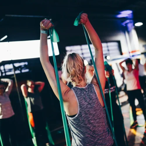 Photo by Geert Pieters group of people in gym while exercising